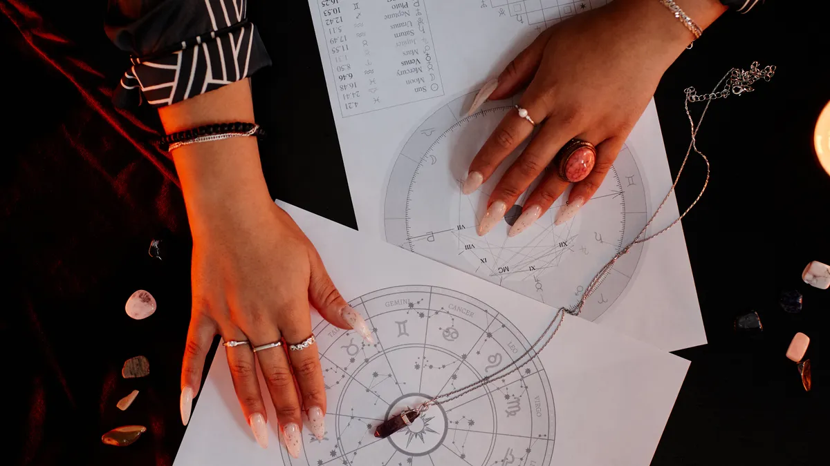 dating after 50: hands holding astrology chart illustration