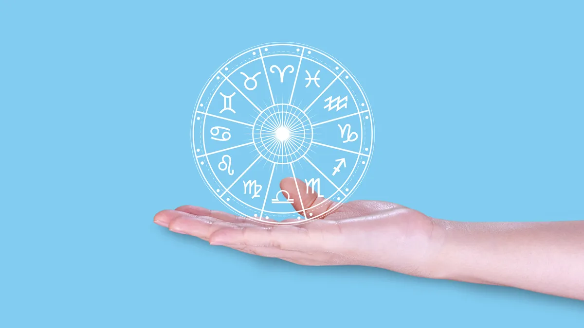 divorce at 50: hands holding astrology birth chart illustration